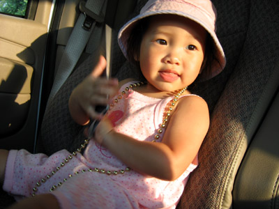 Looking all cute in the drivers seat at sunset wearing those great beads from Dot